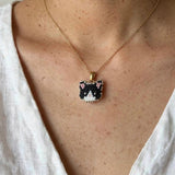 Tuxedo cat necklace on model