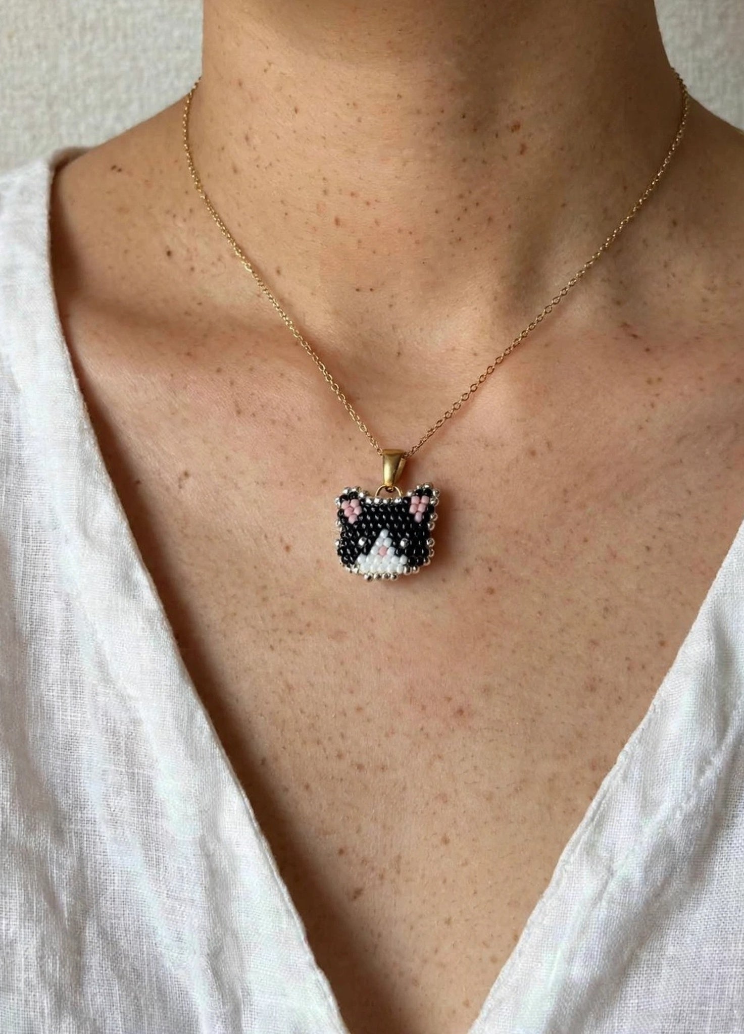 Tuxedo cat necklace on model