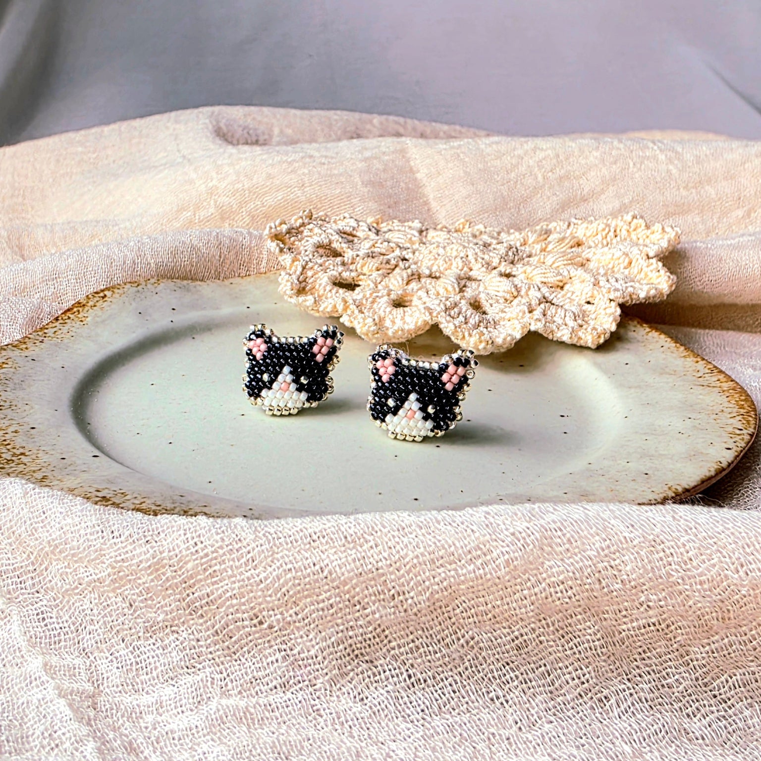 Tuxedo cat stud earrings front