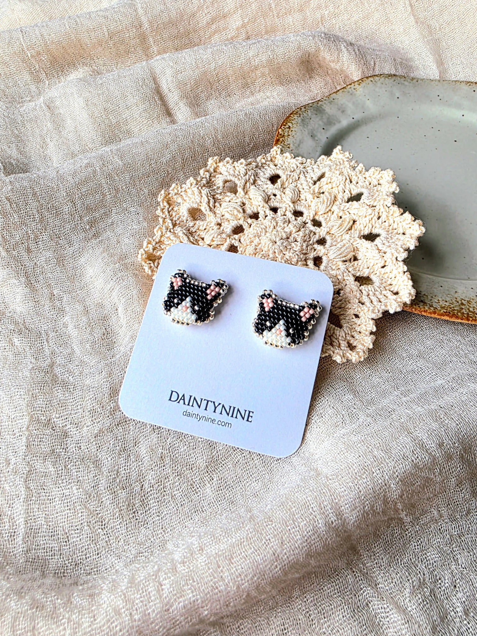 Tuxedo cat stud earrings on card