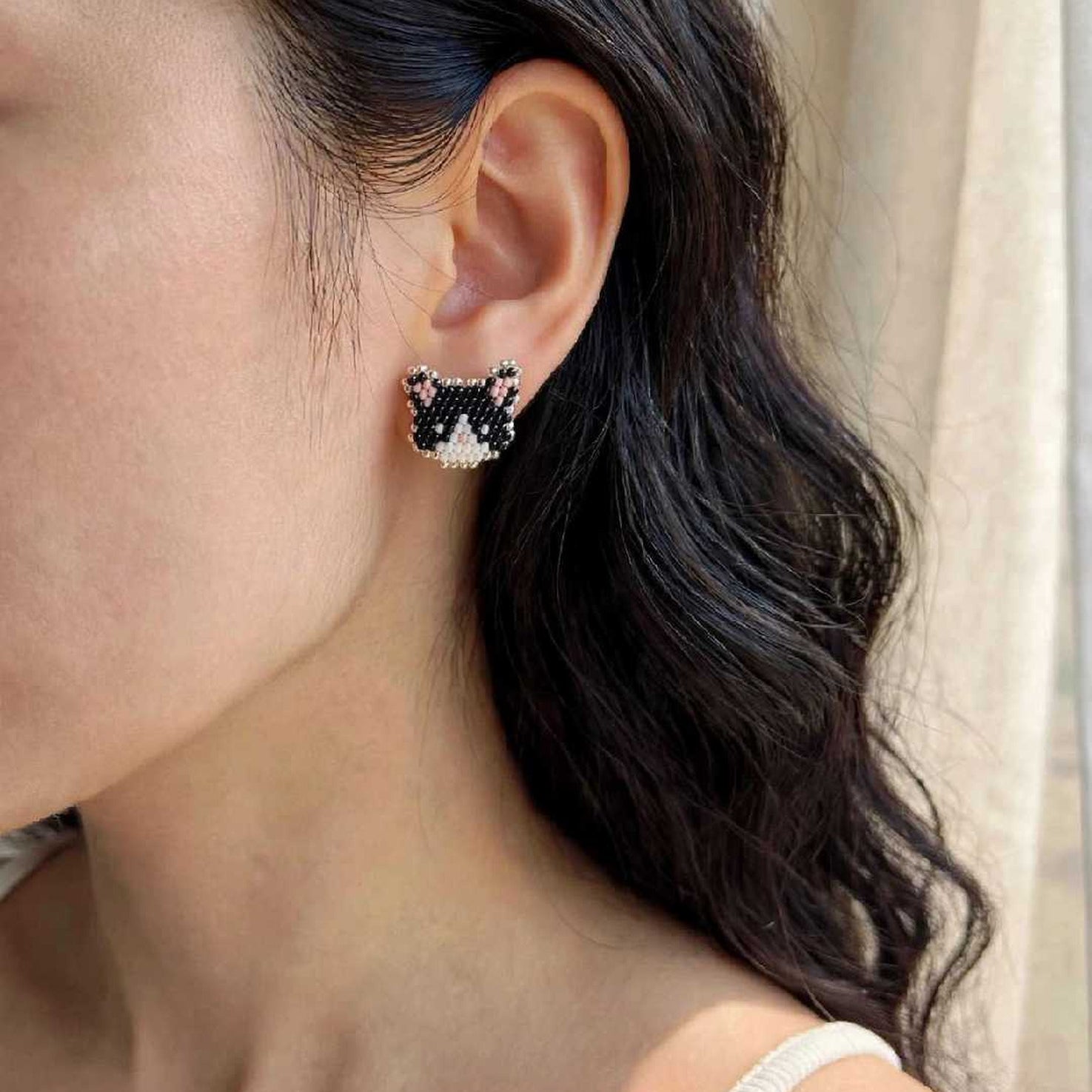 Tuxedo cat stud earrings on model