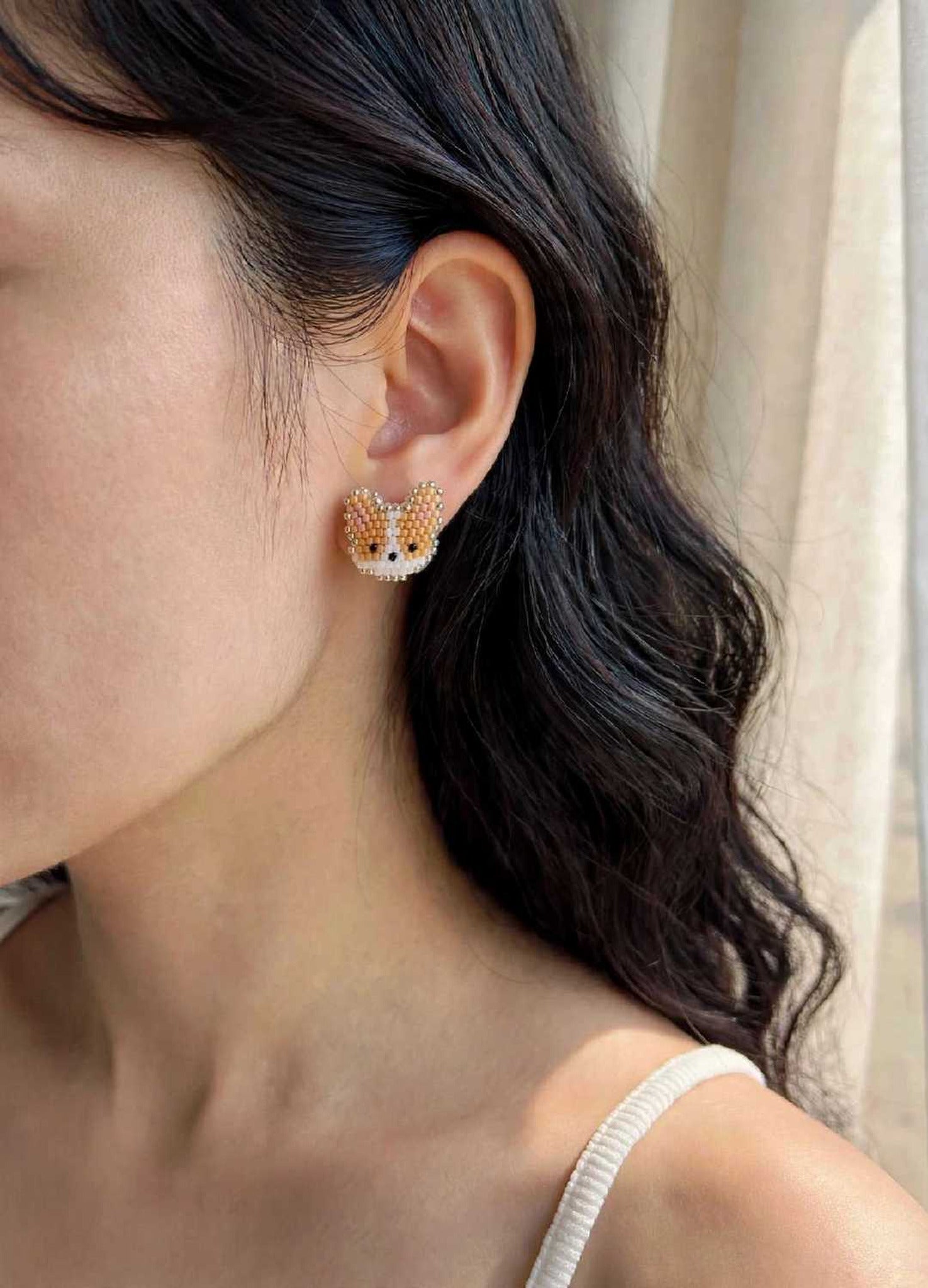 Welsh corgi stud earrings on model