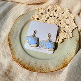 Whale shark drop earrings on card