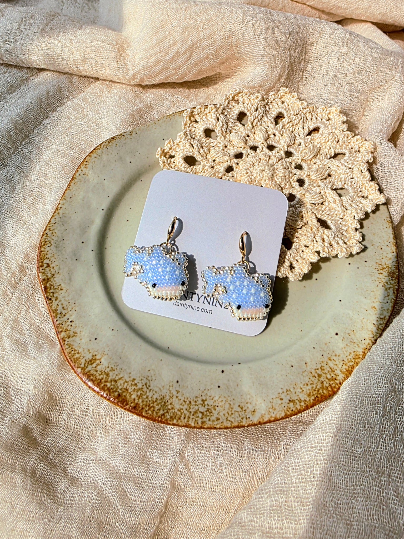 Whale shark drop earrings on card