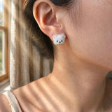 White bear stud earrings on model