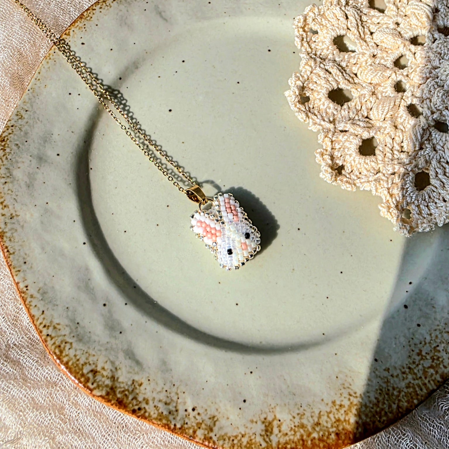 White bunny necklace left
