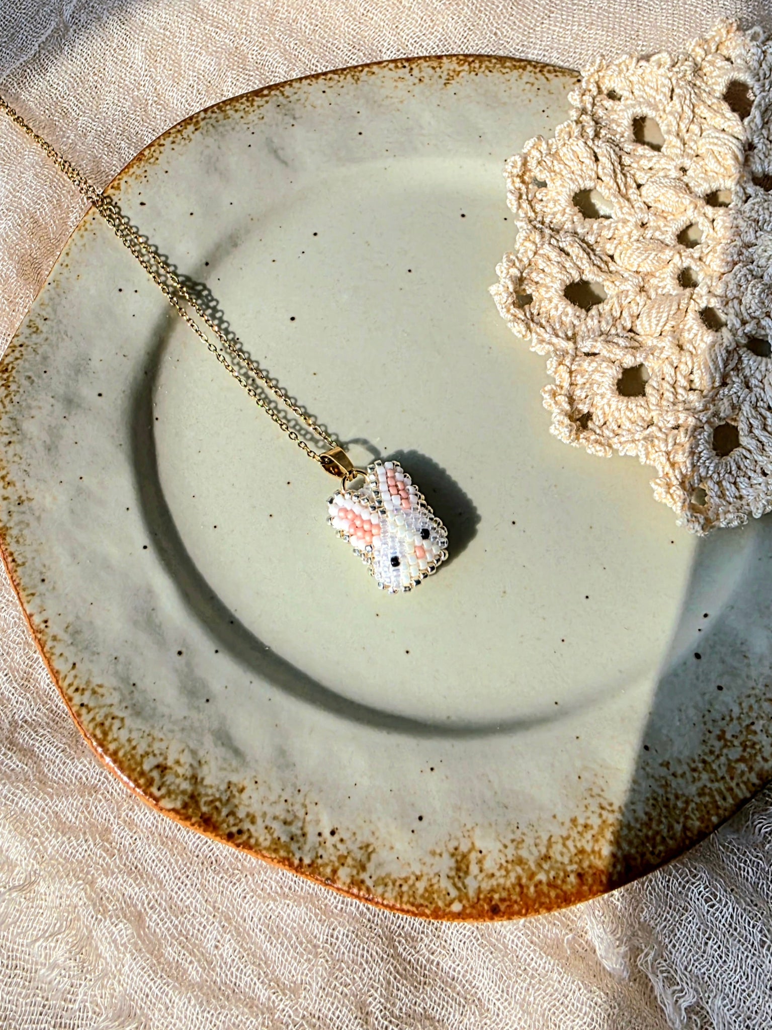 White bunny necklace left
