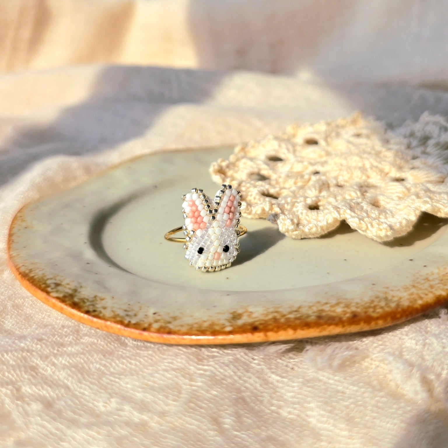 White bunny ring left