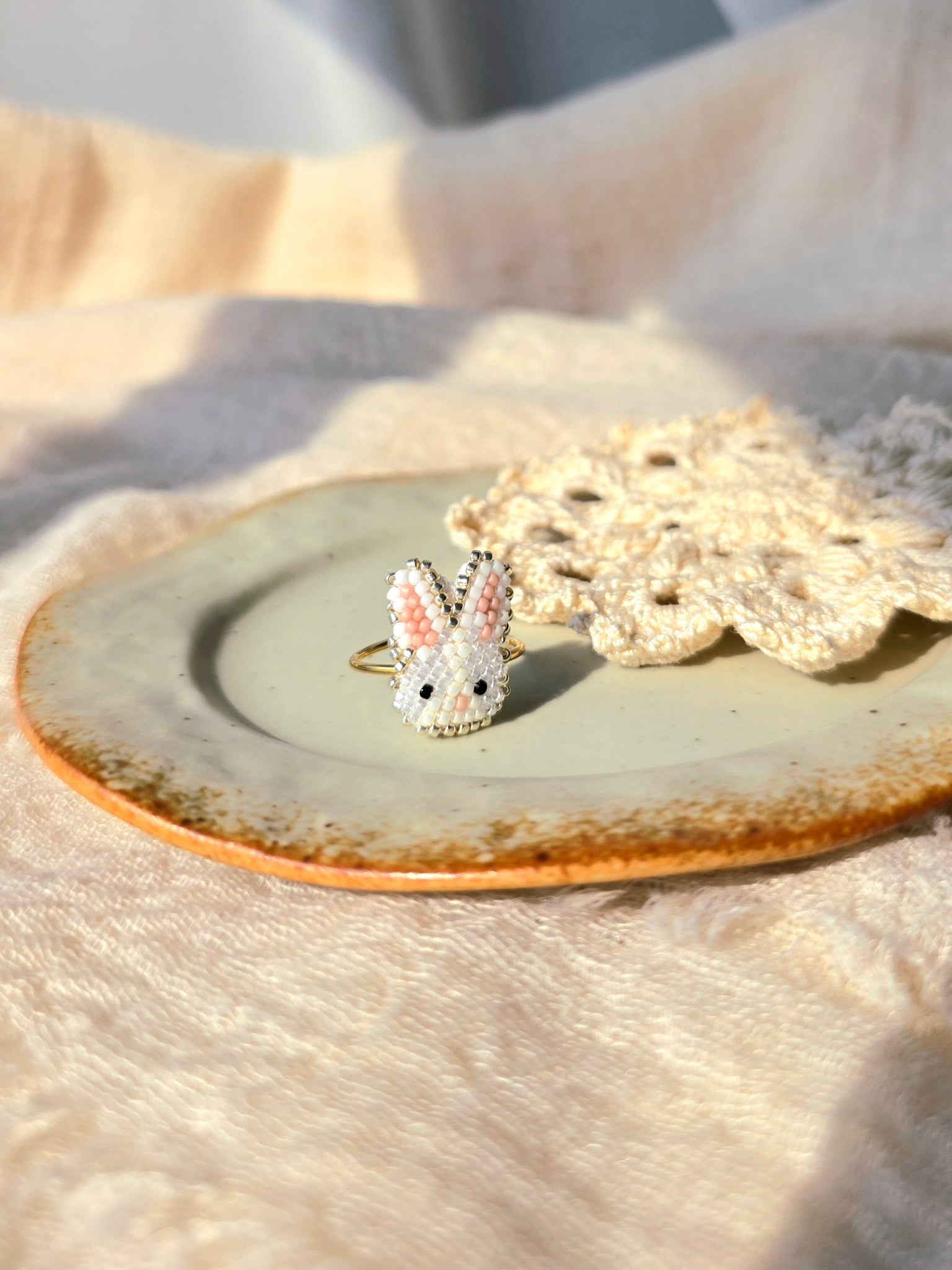 White bunny ring left