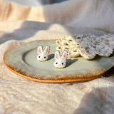 White bunny stud earrings right