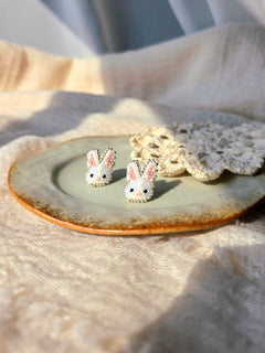 White bunny stud earrings right