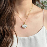 White poodle necklace on model