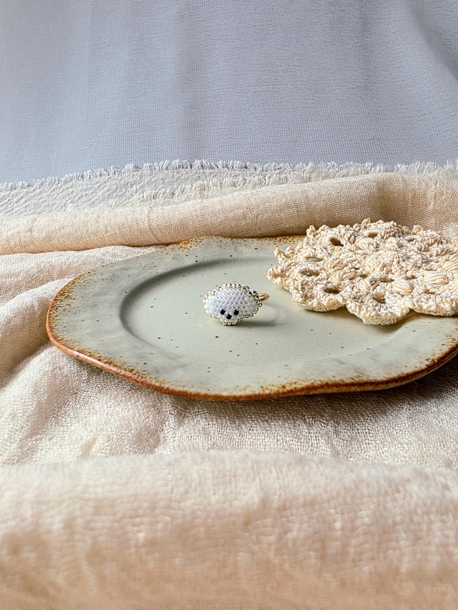 White poodle ring front