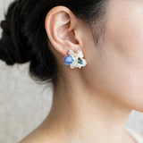 Wildpetals stud earrings in blue on model