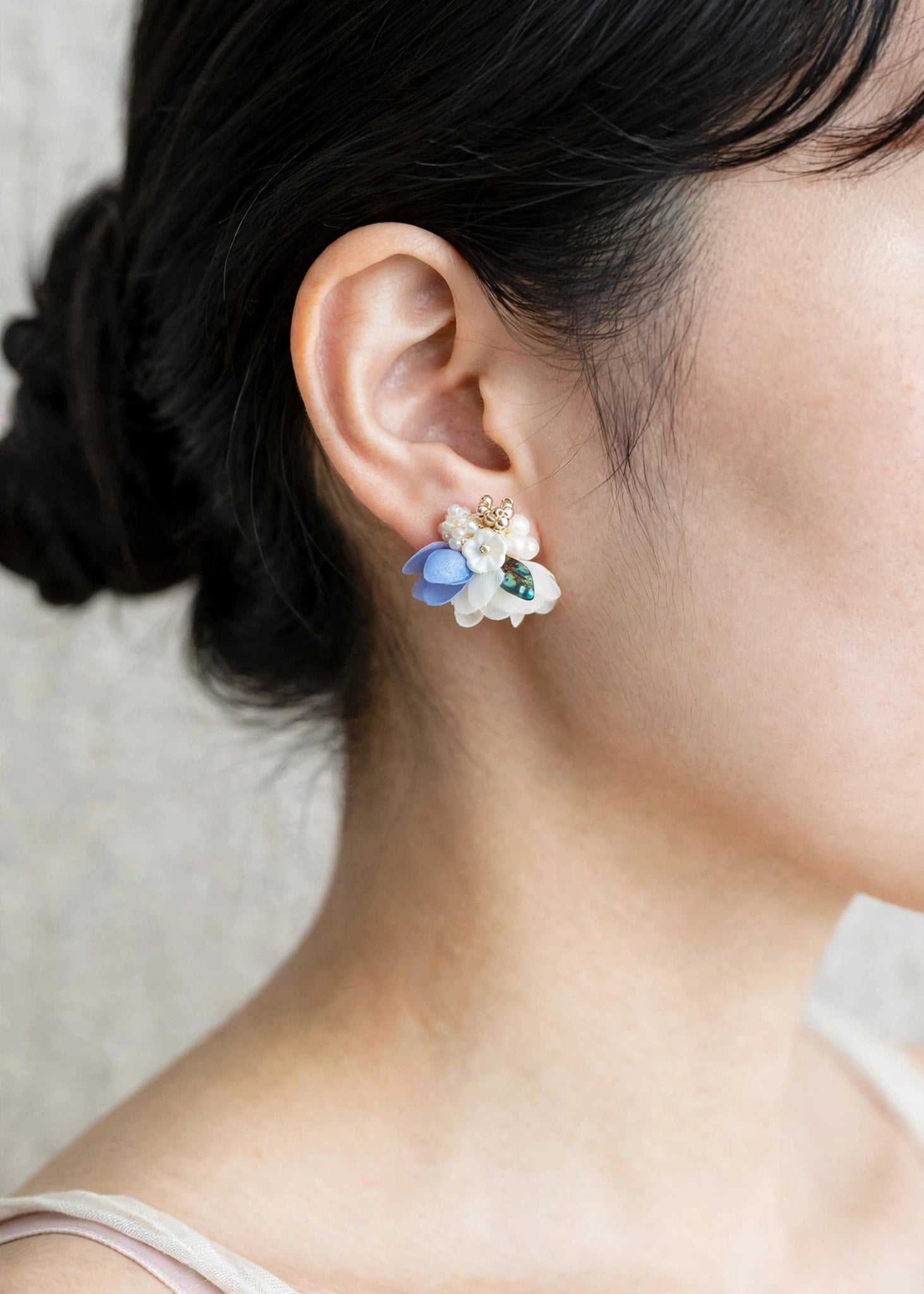 Wildpetals stud earrings in blue on model