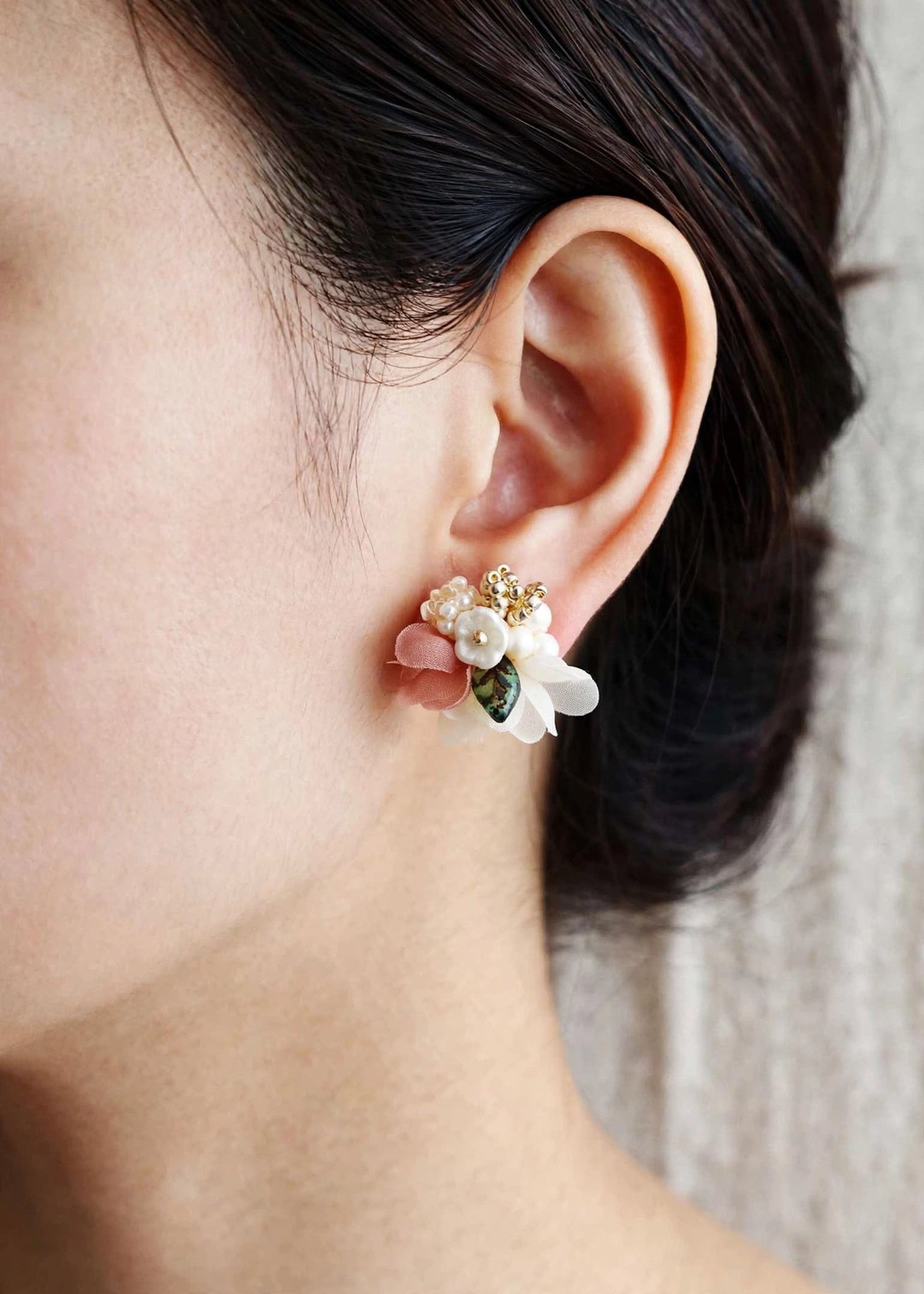 Wildpetals stud earrings in brown on model