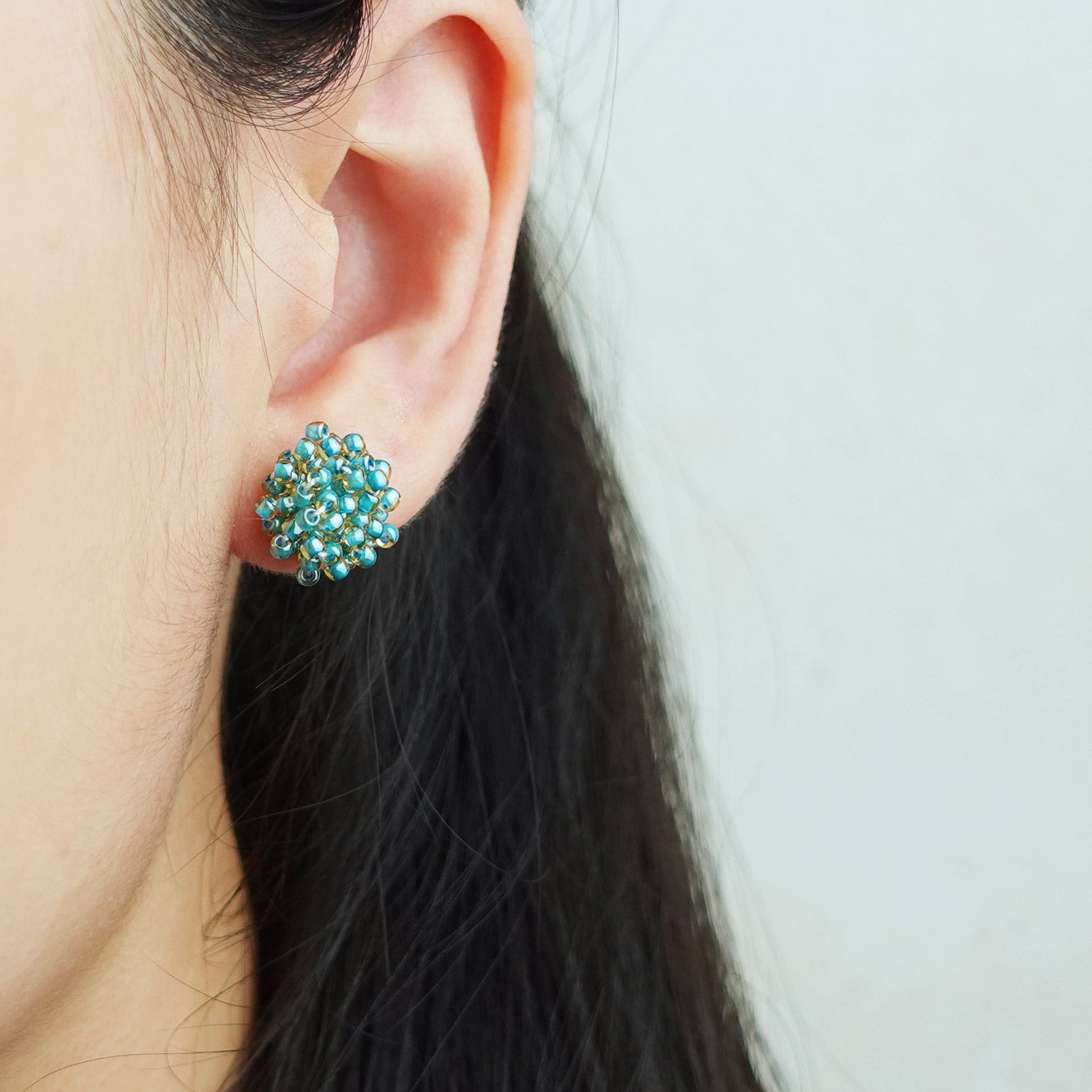 Ariel Stud Earrings in Ocean Green Model