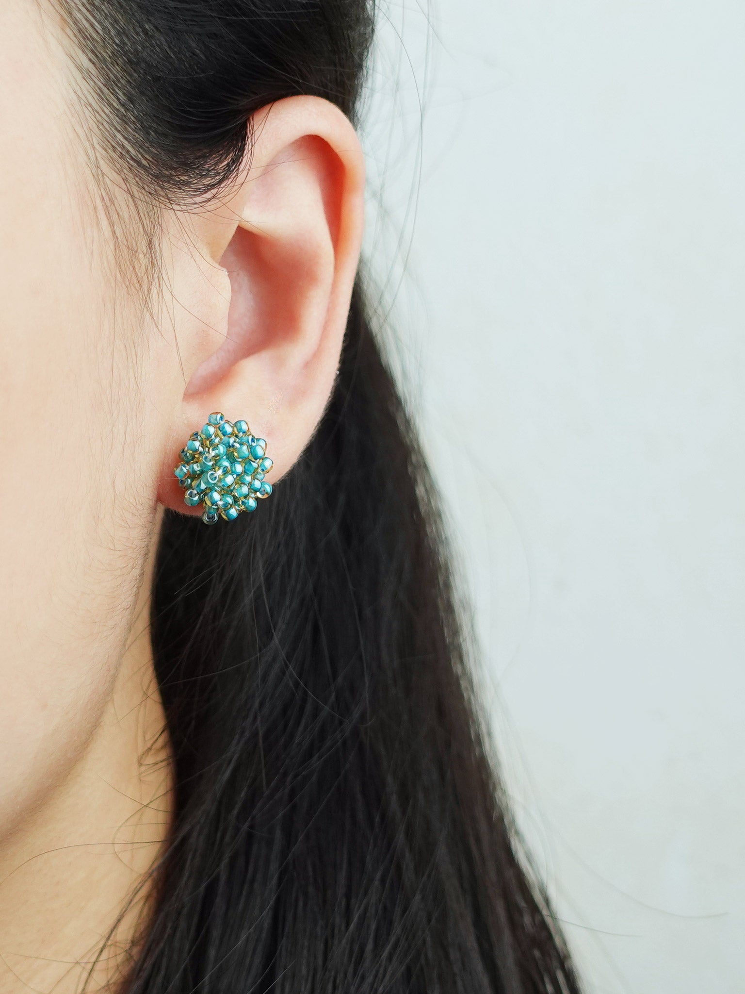 Ariel Stud Earrings in Ocean Green Model
