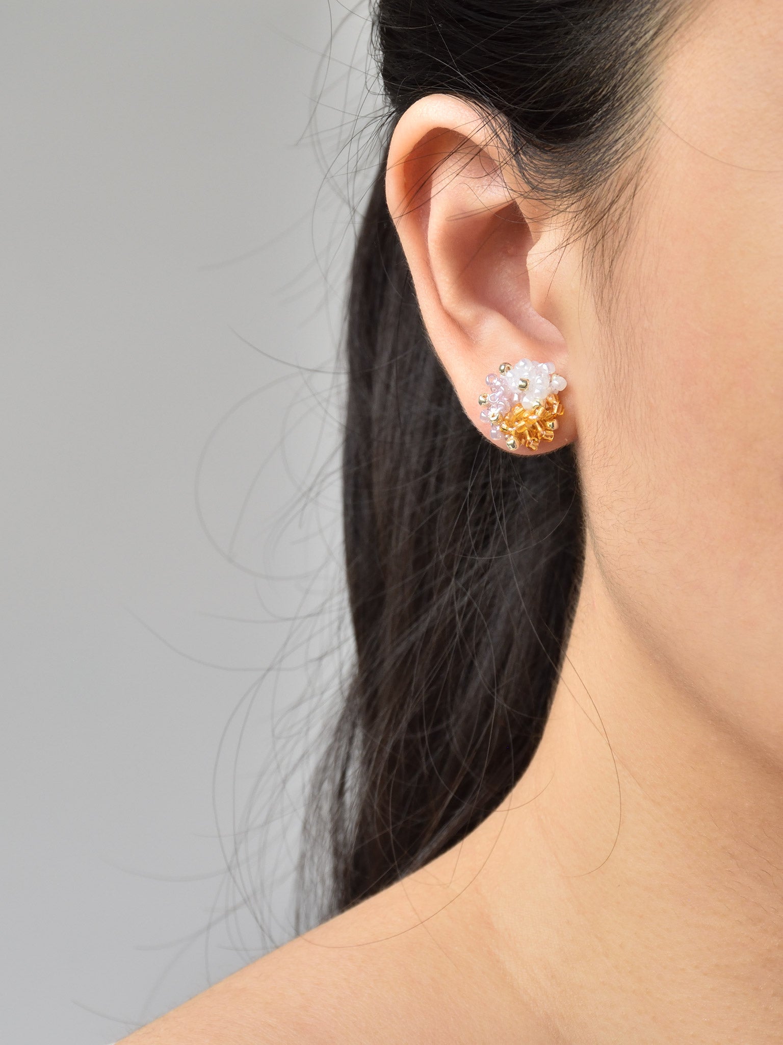 Ariel Trio Stud Earrings in Purple and Topaz Model