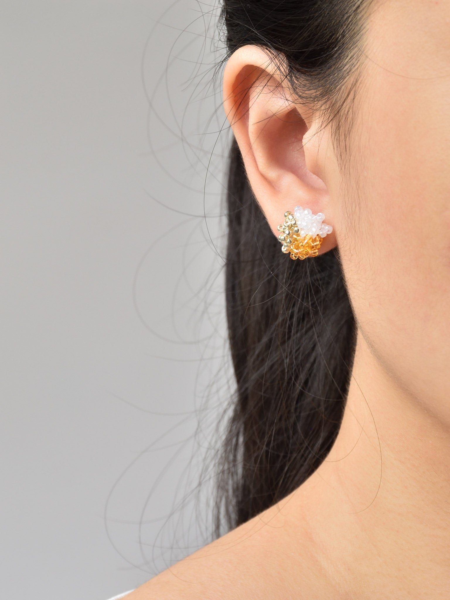 Ariel Trio Stud Earrings in Topaz Model
