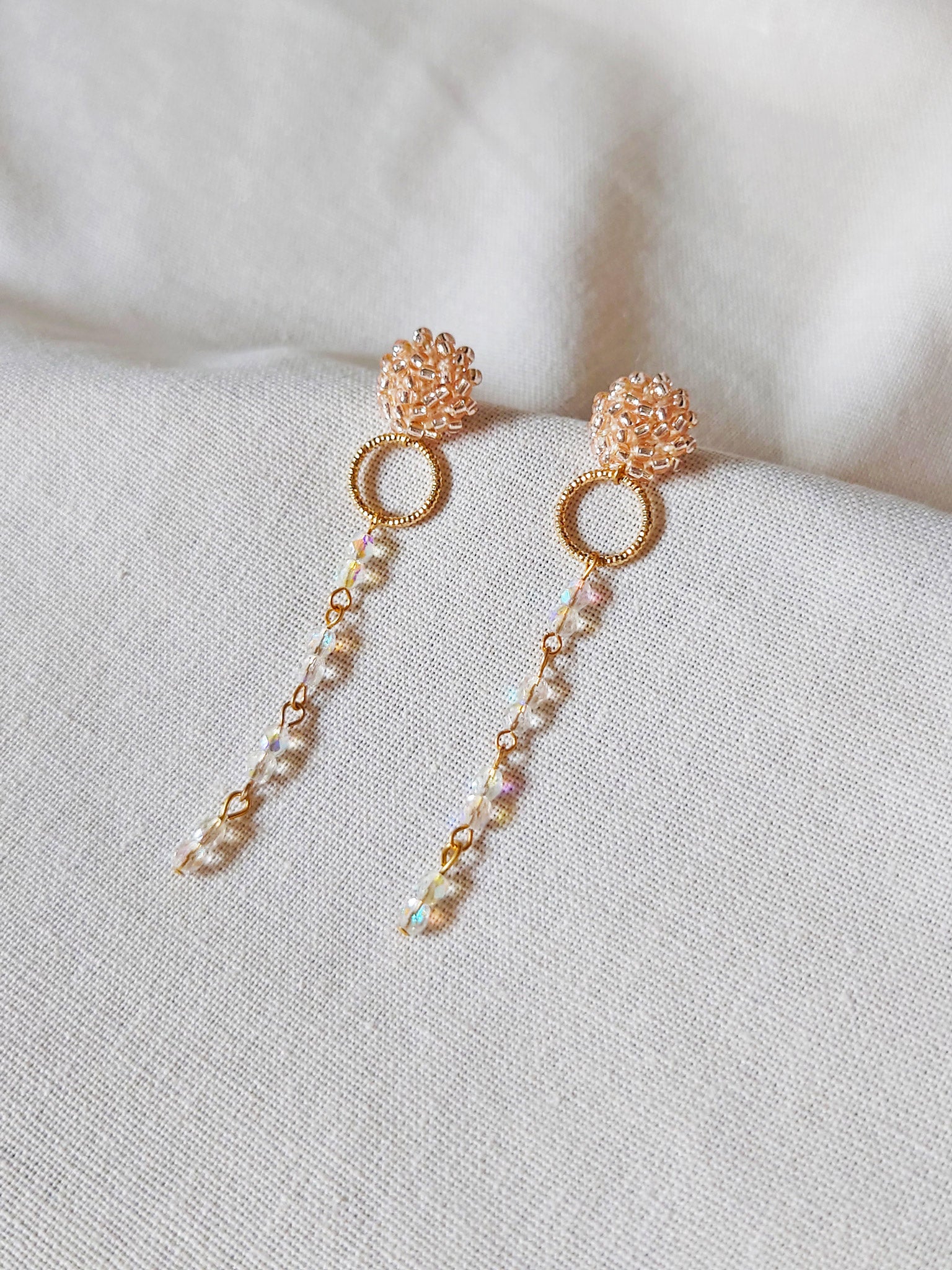 Aurora Crystal Earrings in Champagne Pink Front