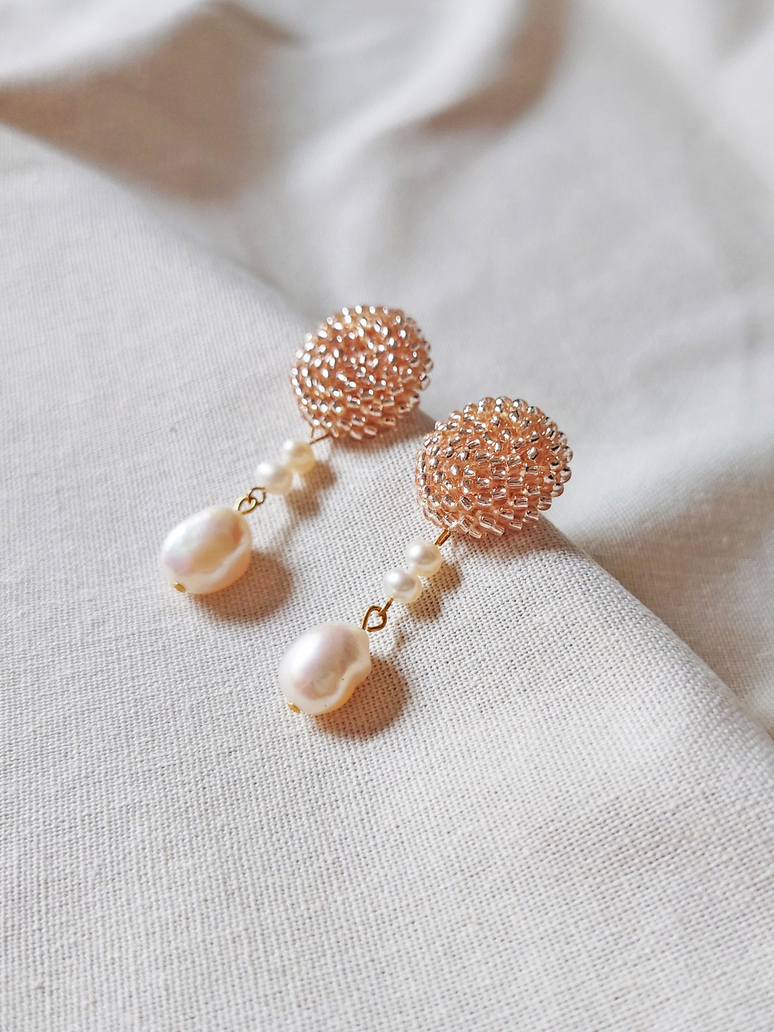 Calypso Dangle Earrings in Champagne Pink Right