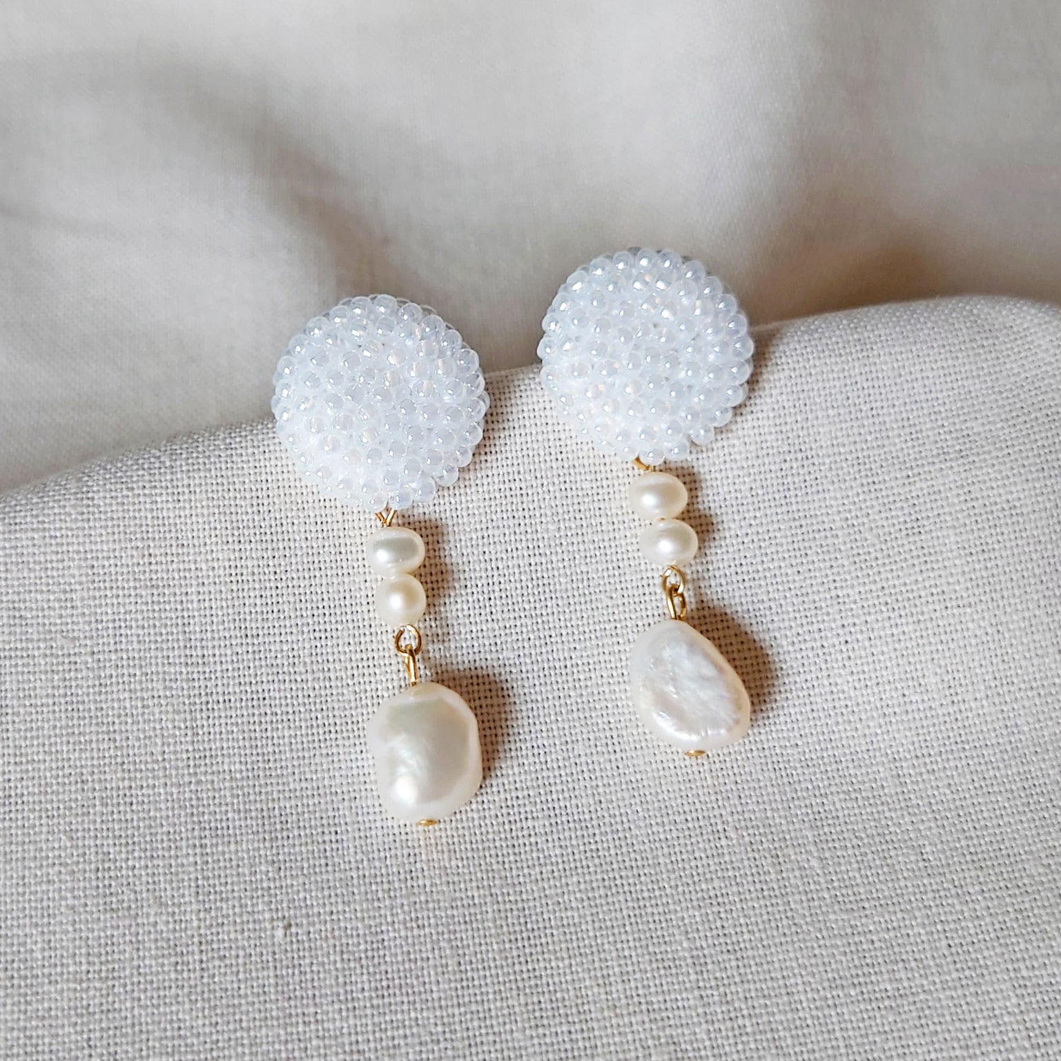 Calypso Dangle Earrings in White Front