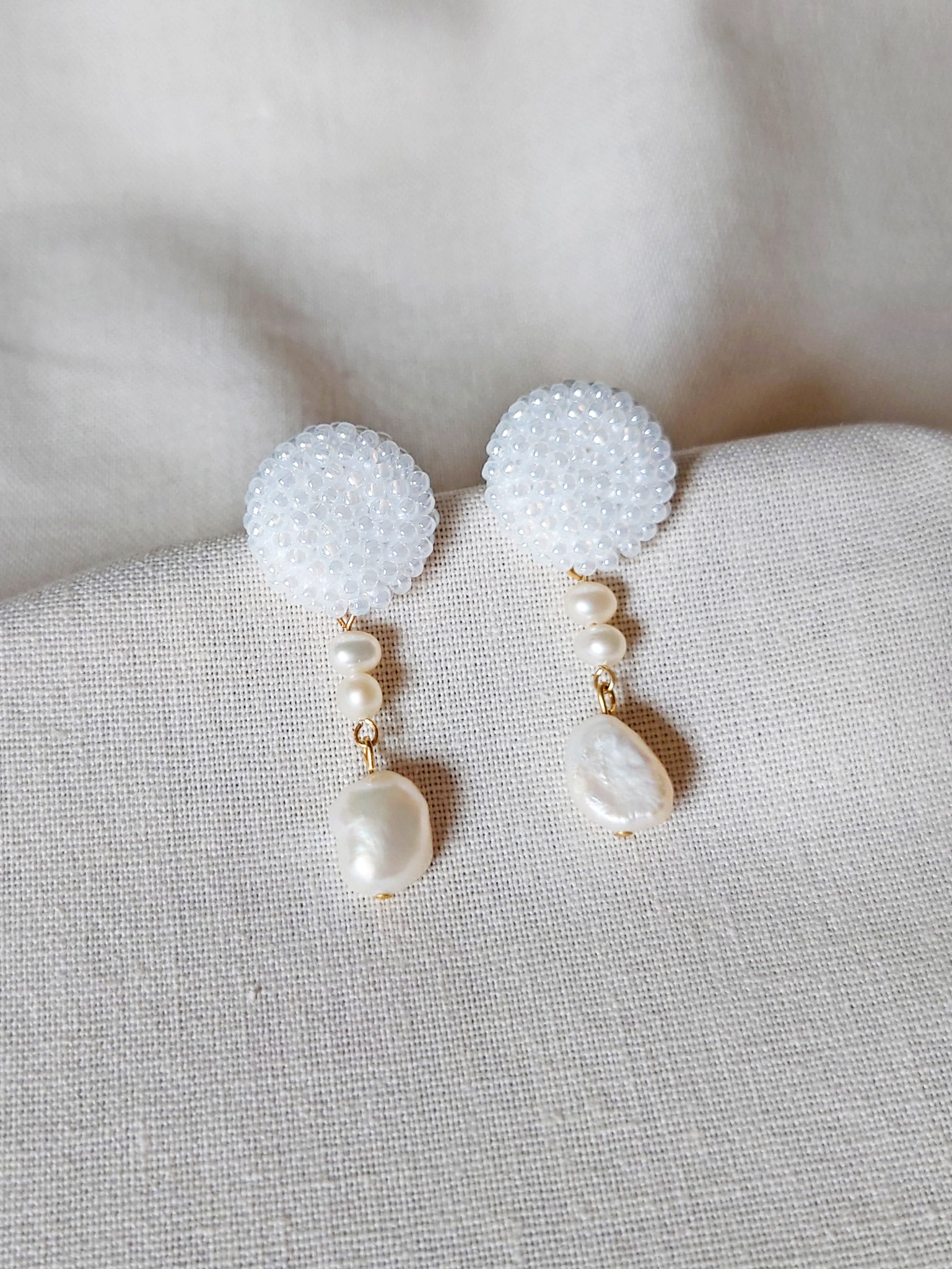 Calypso Dangle Earrings in White Front