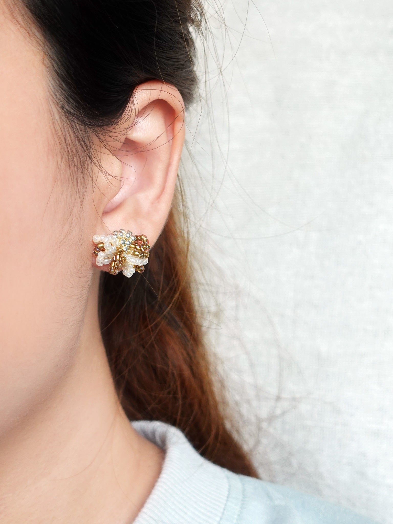 Camellia Bicolor Stud Earrings in Caramel Brown Model