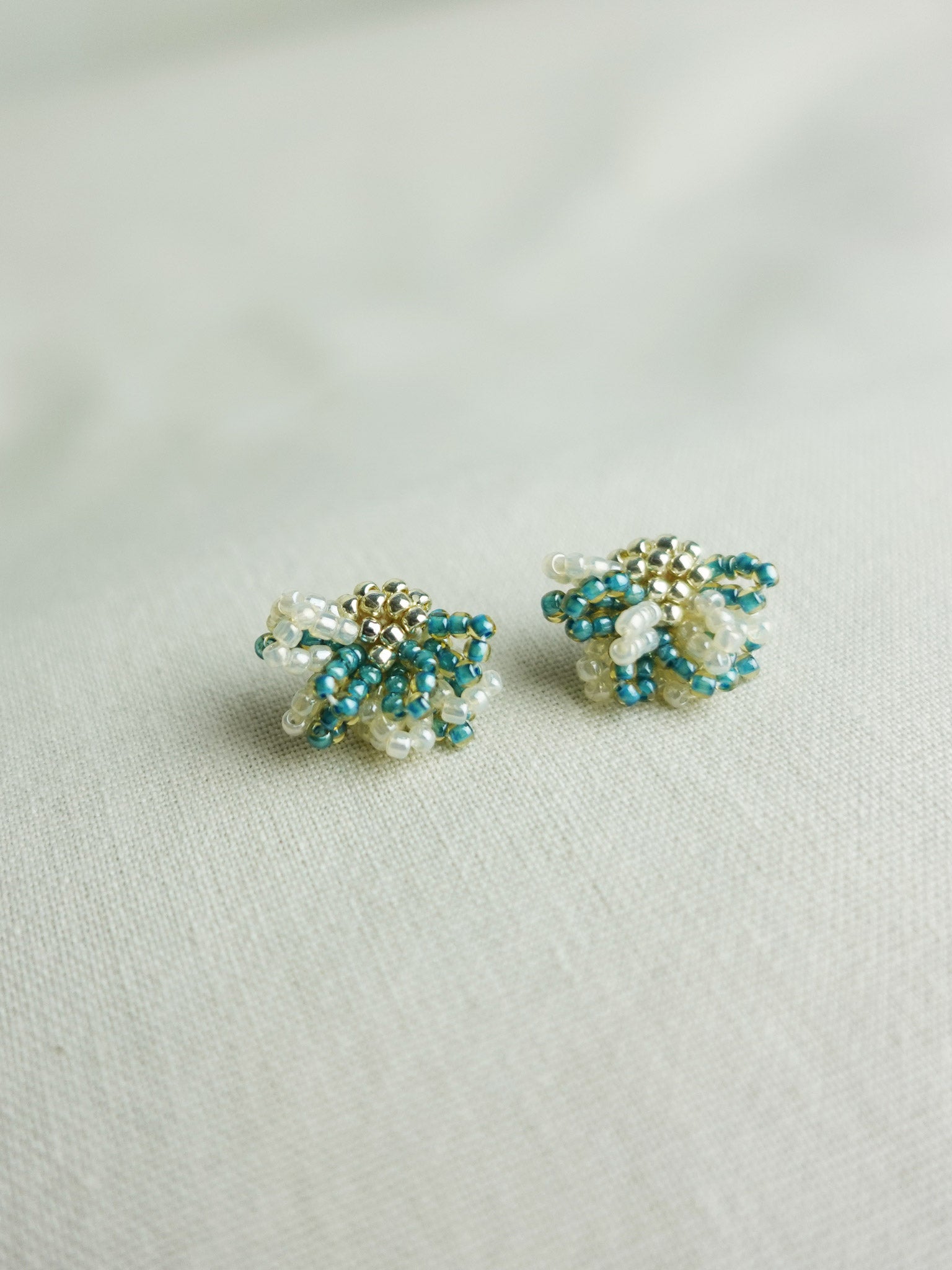 Camellia Bicolor Stud Earrings in Ocean Green Left