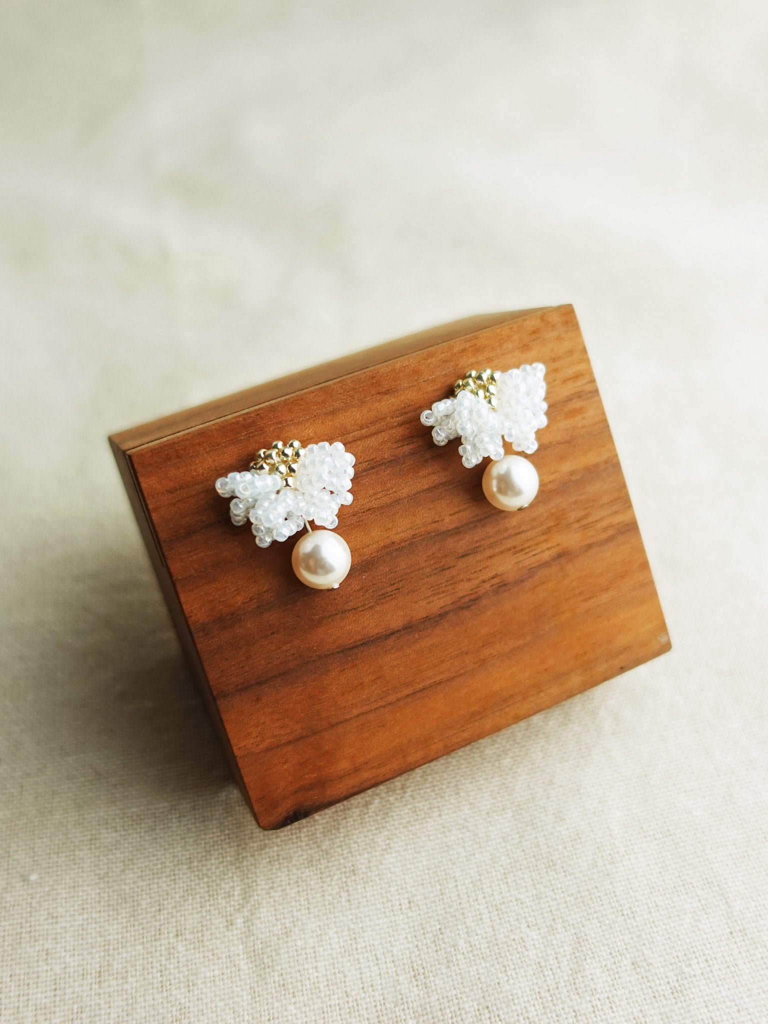 Camellia Mariota Earrings in White Display Top
