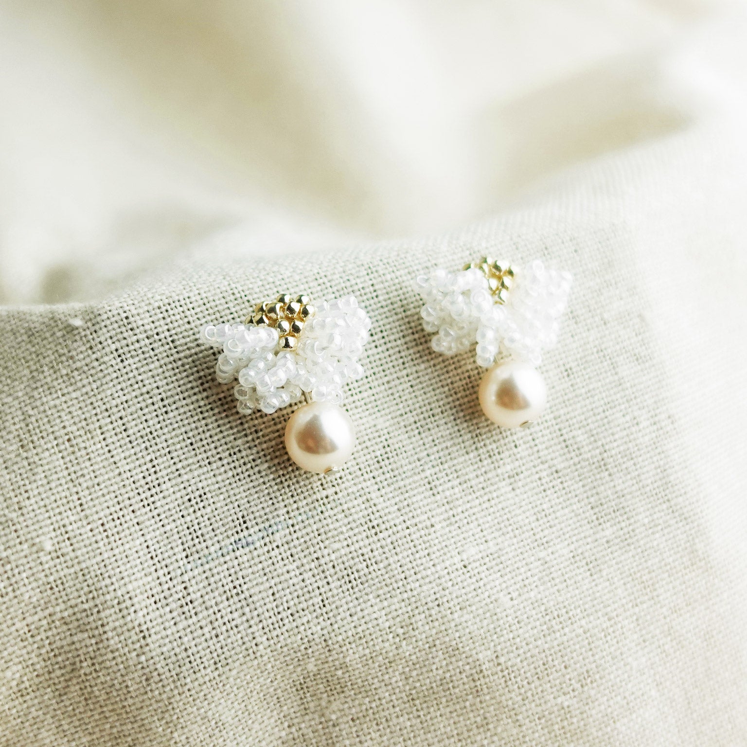 Camellia Mariota Earrings in White Left