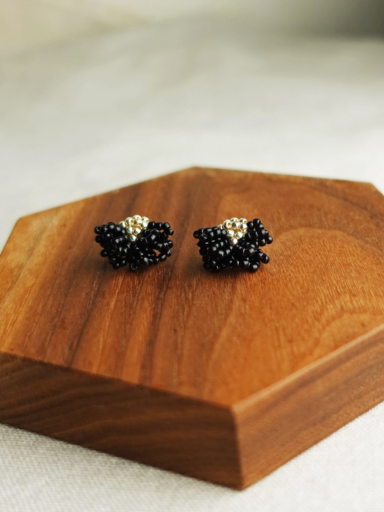 Camellia Stud Earrings in Black Display Front