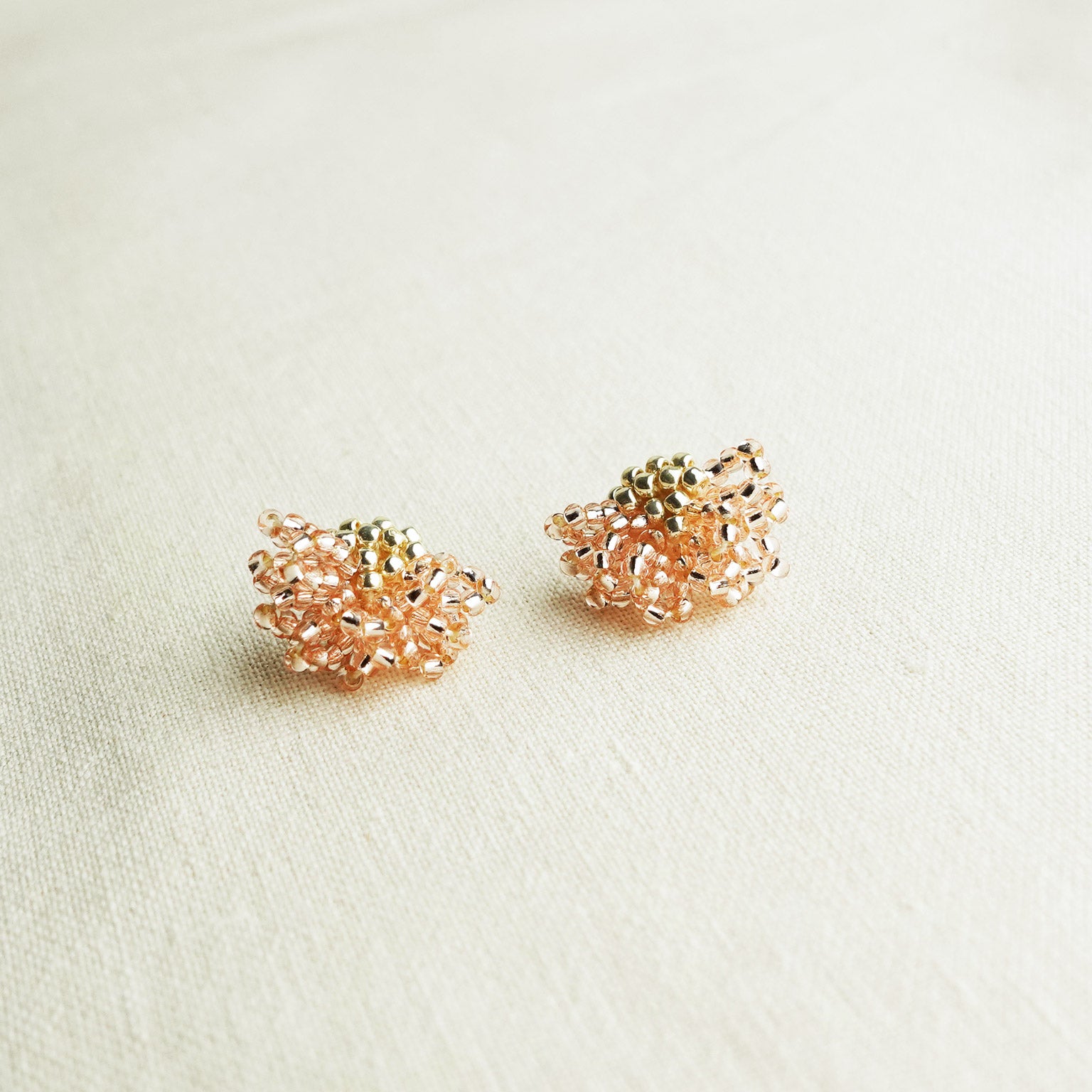 Camellia Stud Earrings in Champagne Pink Front
