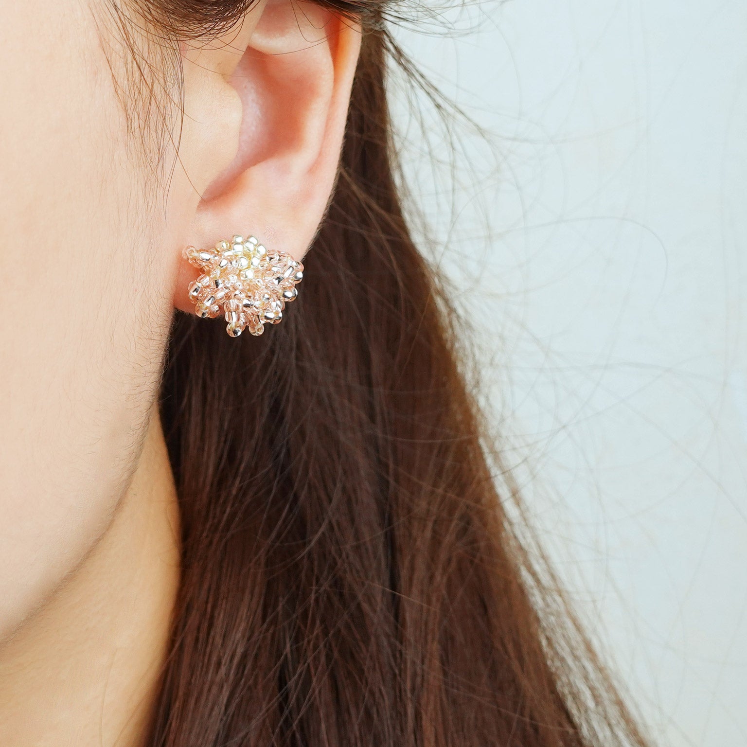 Camellia Stud Earrings in Champagne Pink Model