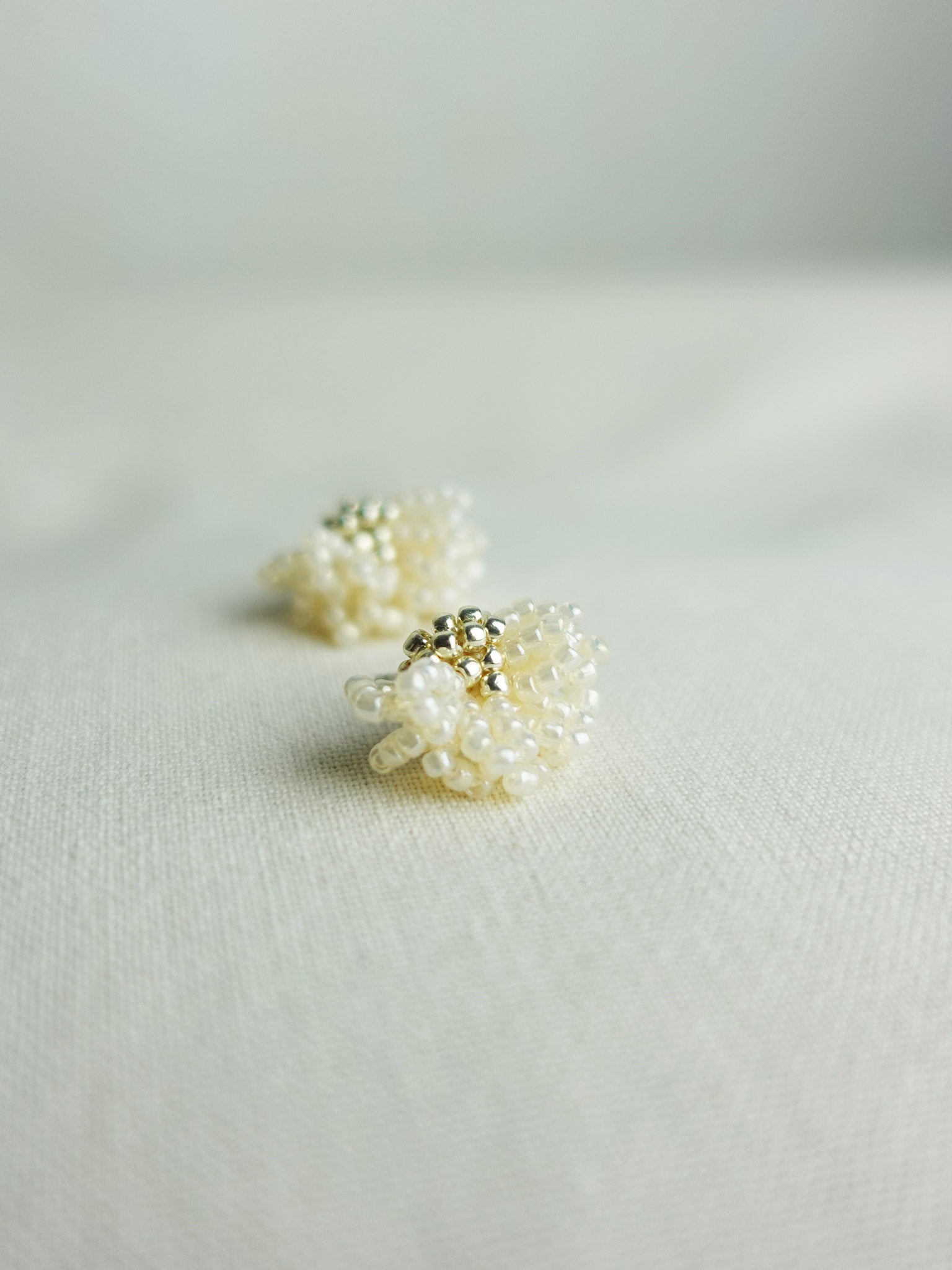 Camellia Stud Earrings in Ivory Left