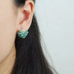 Camellia Stud Earrings in Ocean Green Model