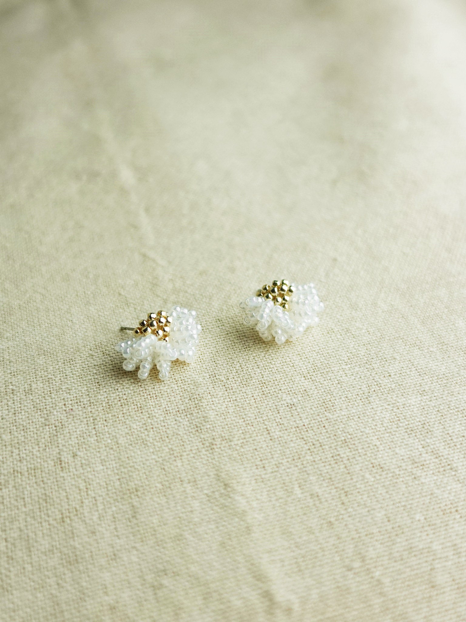 Camellia Stud Earrings in White Left