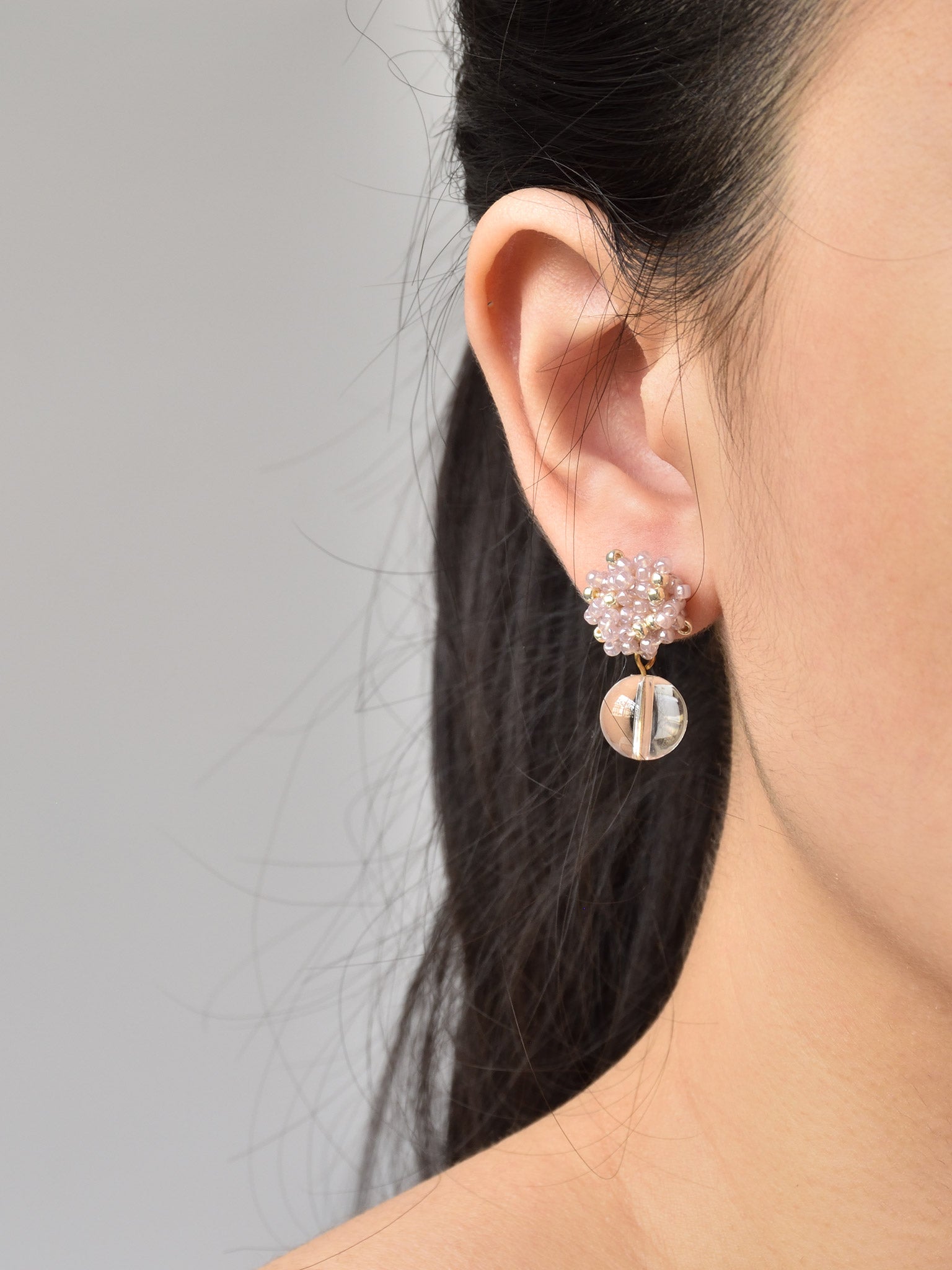 Coralia Clear Quartz Crystal Earrings in Purple Model