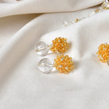 Coralia Quartz Earrings in Topaz Display
