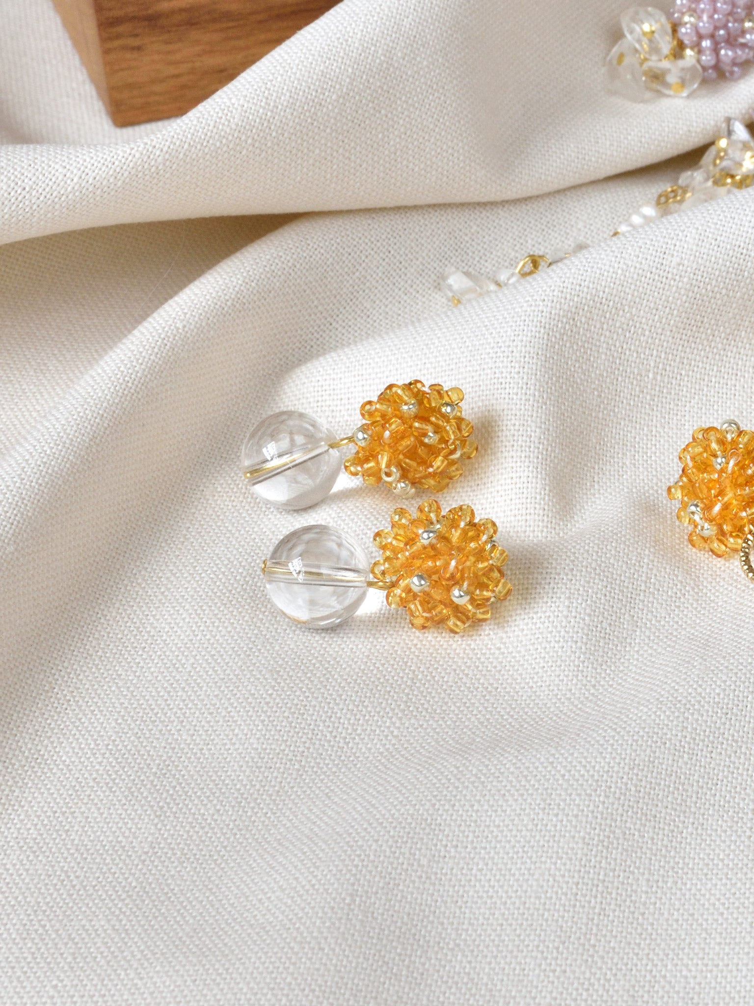 Coralia Quartz Earrings in Topaz Display