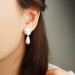 Diana Teardrop Mariota Earrings in White Model