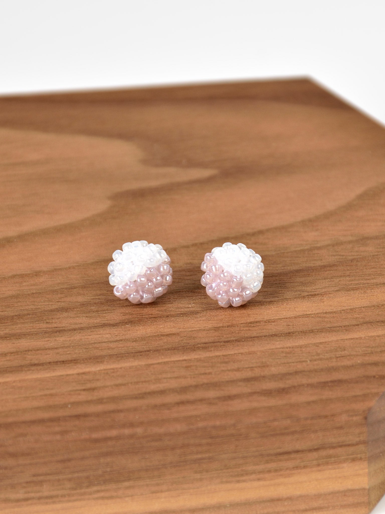 Duo Stud Earrings in Purple on Wood Display 1