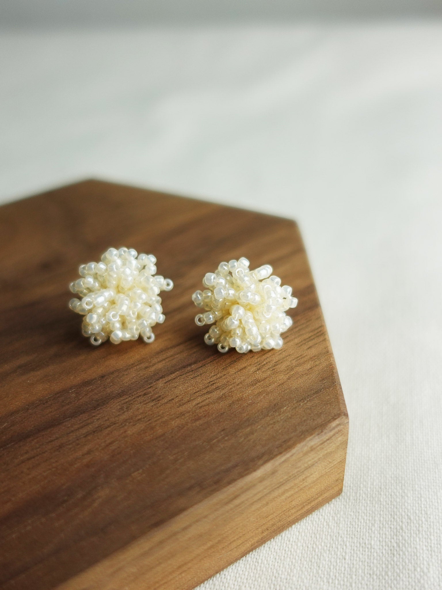 Fluffy Earrings in Ivory Display Close