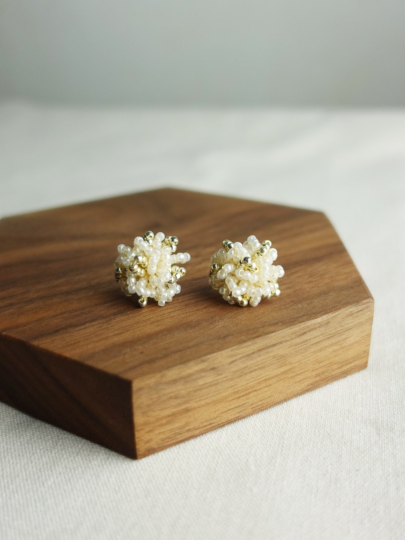 Fluffy Star Dust Earrings in Ivory Display Front