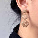 Juno Dangle Earrings in Champagne Pink Model 2