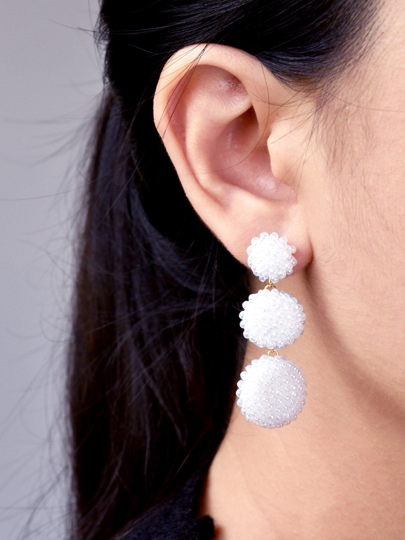 Juno Dangle Earrings in White Model