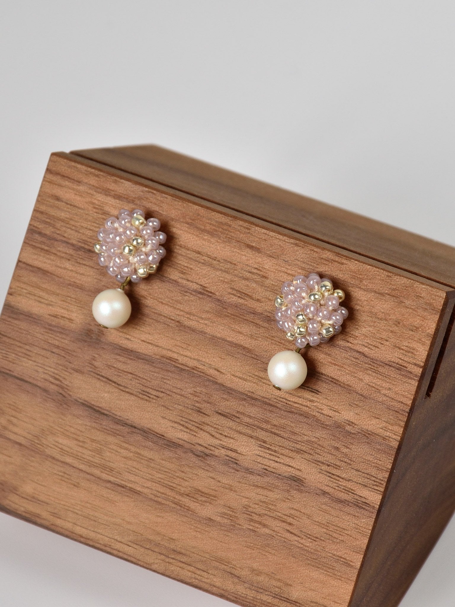 Layna Pearlescent Swarovski Pearl Studs in Purple Left