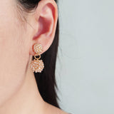Larissa Drop Earrings in Champagne Pink Model