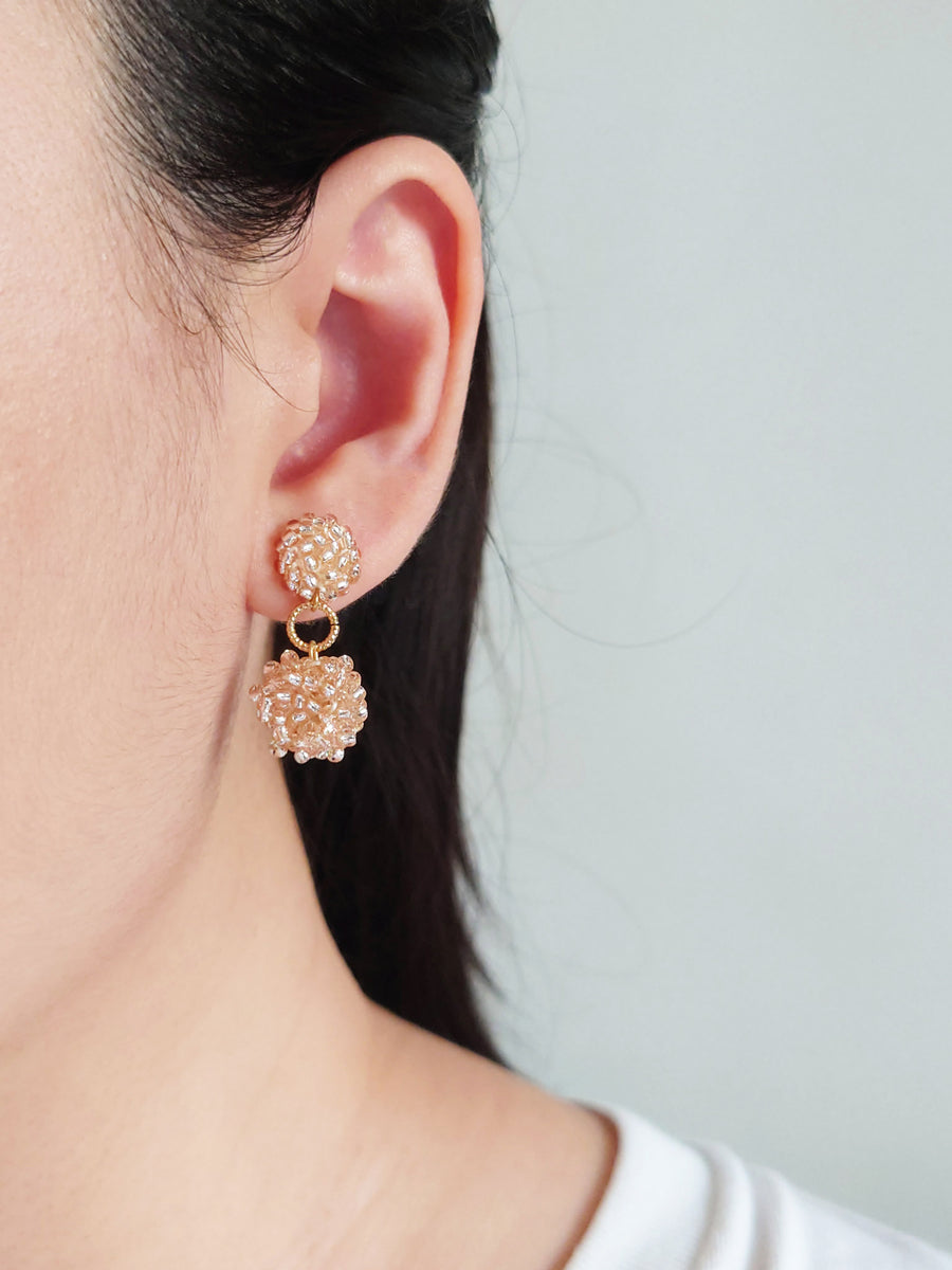 Larissa Drop Earrings in Champagne Pink Model